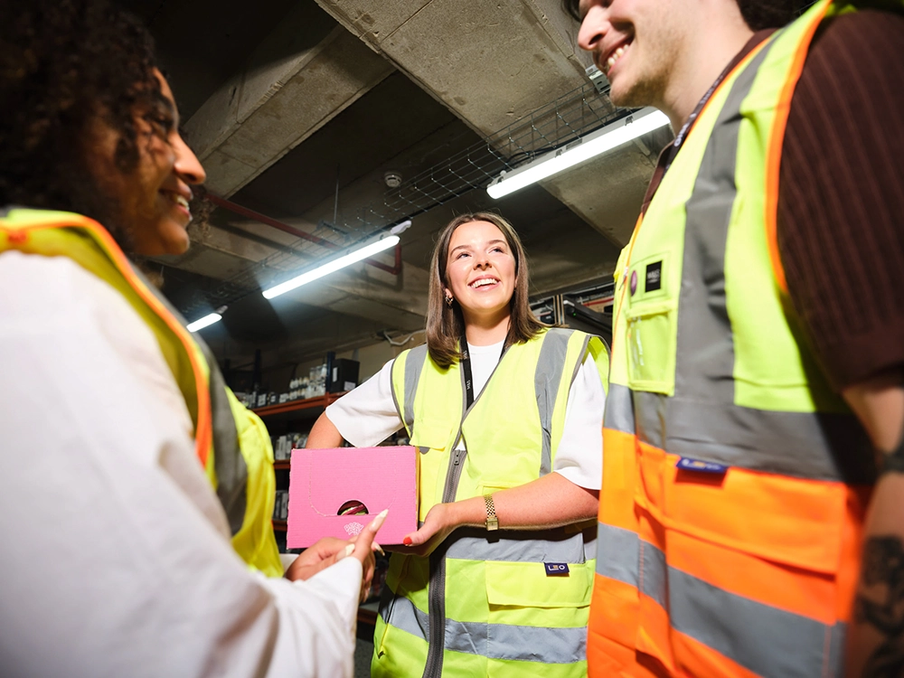 Apprentices talking together at their workplace